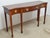 Console Table by Baker - Historic Charleston Collection. Store item #577. It features inlaid wood and brass hardware.