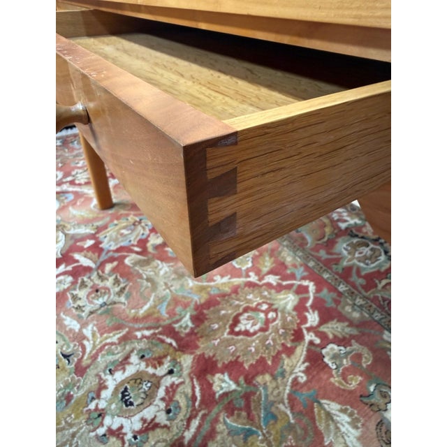 A Scandinavian-style flat desk, attributed to Petersen Bernt (1937-2007), made in the 1960s. The light walnut top features...