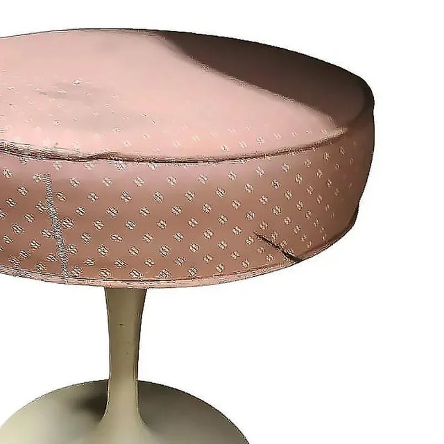 Mid-century Tulip stool with a white enameled aluminum casted base and a newly covered Pink knit seat. 1956, United States