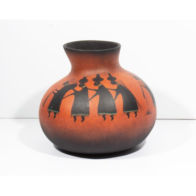 A 1991 gourd vase by American artist Robert Rivera. Made from a gourd, this vase is hand-painted and depicts multiple...