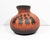 A 1991 gourd vase by American artist Robert Rivera. Made from a gourd, this vase is hand-painted and depicts multiple...