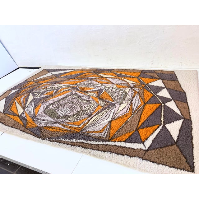 One rug from the 1970s. Synthetic fiber. Good used condition. Not heavily soiled. However, it should be professionally...