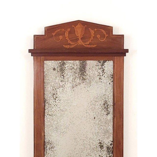 A Danish pier mirror, inlaid mahogany, old glass.