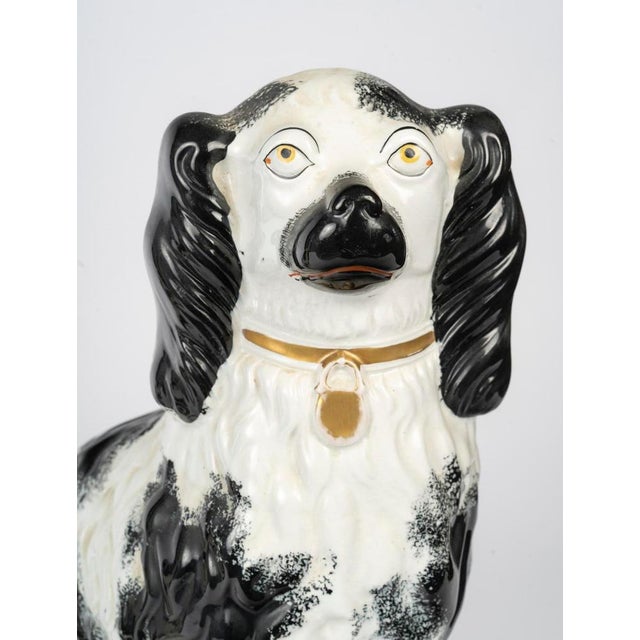 Porcelain sculpture depicting King Charles Spaniels, 20th century. Porcelain sculpture depicting King Charles Spaniels,...
