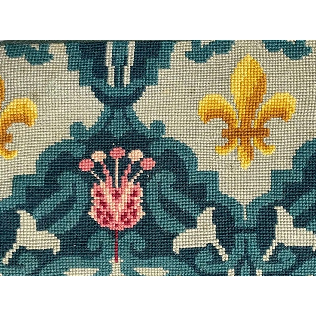 Handwoven in wool, this 7x9 antique Aubusson rug is a refined example of late 19th-century French tapestry weaving....