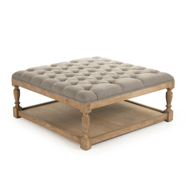 The Square Tufted Ottoman from Zentique is a versatile coffee table alternative with a button-tufted cushion top and a...