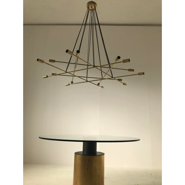 Beautiful Italian brass chandelier Stilnovo style. 16 bulbs up to 100W each, with beautiful patina on the brass parts, the...