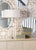 Naomi lamp is an elegant crystal and brass 32" table lamp. Its gracefully curved hourglass silhouette is topped with a...