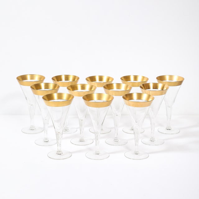 This set of 12 Mid-Century Modernist gilt-rimmed water glasses, designed by the iconic American glassware designer Dorothy...