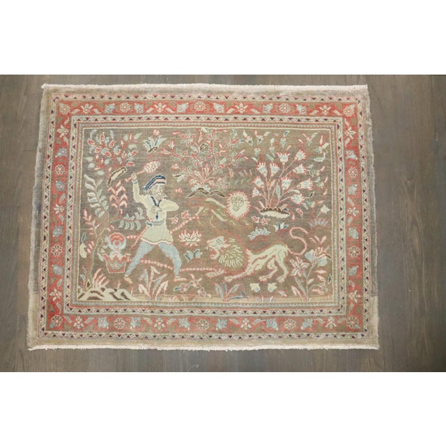 a vintage persian kashan rug depciting a hunting scene