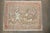 a vintage persian kashan rug depciting a hunting scene