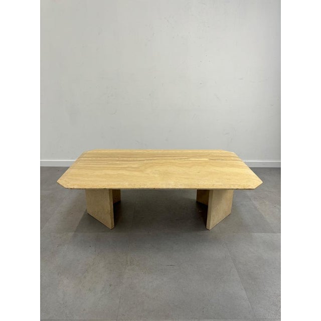 Italian travertine coffee table. consists out of two pieces, good overal condition. One chip underneath surface, not...