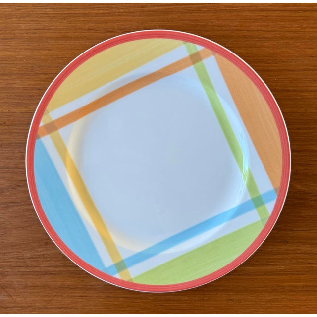 Set of 4 porcelain dinner plates in the Switch Bonjour Monsieur pattern by Villeroy & Boch. The set features multicolor...