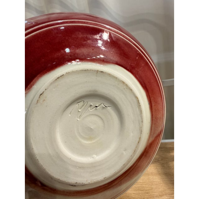 A striking stoneware vessel by Ben Owen III, a celebrated American potter known for his mastery of glaze chemistry and...