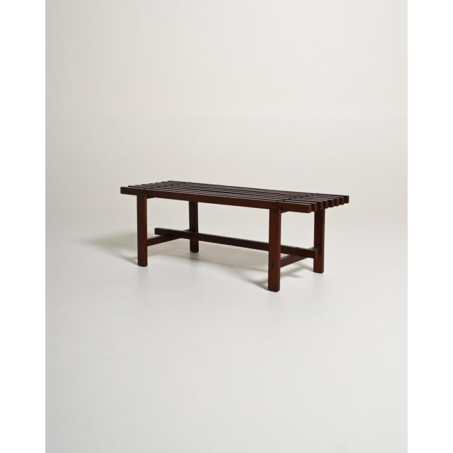 Bench with slatted top and frame with reinforced crosspieces. Made in Italy, 1970s. Made in Italy in the 1970s, this...