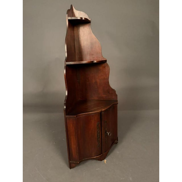 19th-century French corner cupboard crafted in walnut and dating to circa 1850. Designed to fit neatly into a corner, this...
