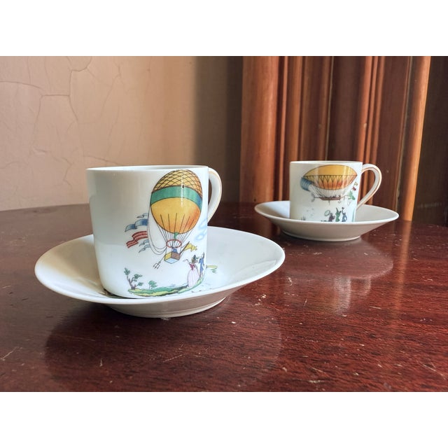 Charles Field Haviland Limoges France porcelain demitasse cup and saucer set featuring the “Fancy Flite” hot air balloon...