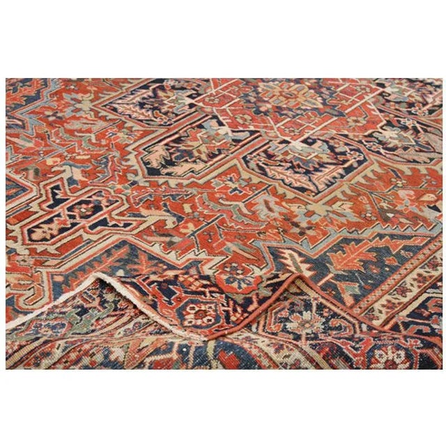 Traditional Vintage handwoven Persian Heriz rug features an intricately nuanced medallion and pendant design with blue-...