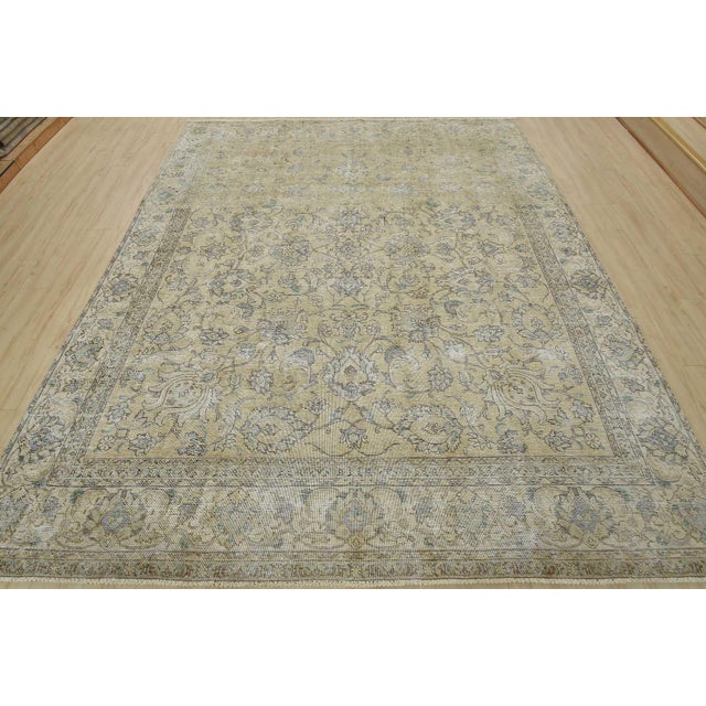 An authentic vintage traditional Tabriz rug hand-knotted with an all-wool pile on a cotton foundation. This oriental rug...