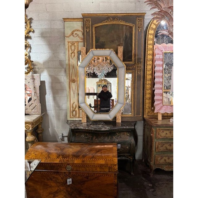 Modern Murano opalescent milk glass and brass octagonal mirror. Circa 2000. A fine addition to any home! 32w x 48H