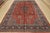 An authentic vintage traditional Sarouk rug hand-knotted with fine wool and natural dyes. This rug features a central...
