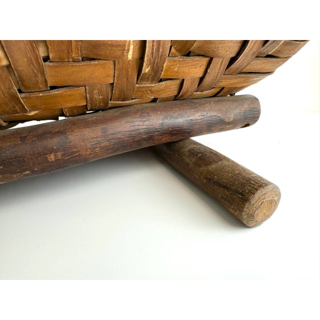 Embrace the rustic charm of this vintage bentwood log basket, skillfully woven to provide both functionality and aesthetic...