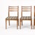 A classic set of four mid-century dining chairs by Nathan Furniture, crafted in warm teak with gently curved ladder backs...