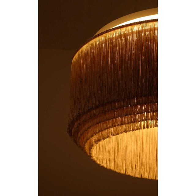 Large and rare model with white/ivory colored fringes, produced by Hans-Agne Jakobsson, Markaryd, Sweden, 1960s. This...