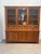 Bring warmth, functionality, and timeless craftsmanship into your interior with this impressive solid teak display...