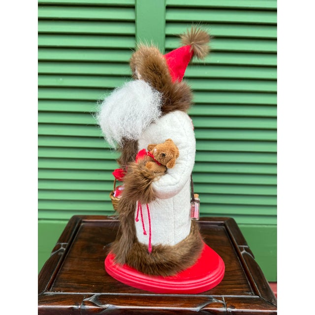 In the tradition of the antique German Belsnickle or Father Christmas figures, this Spirit of Love or Saint Valentine is...