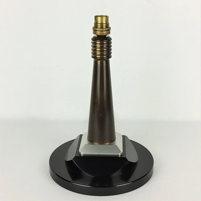 1950 desk lamp. Cone foot in solid brass with gunmetal patina. Powdered gold decor at the neck and at the base. Fluted...