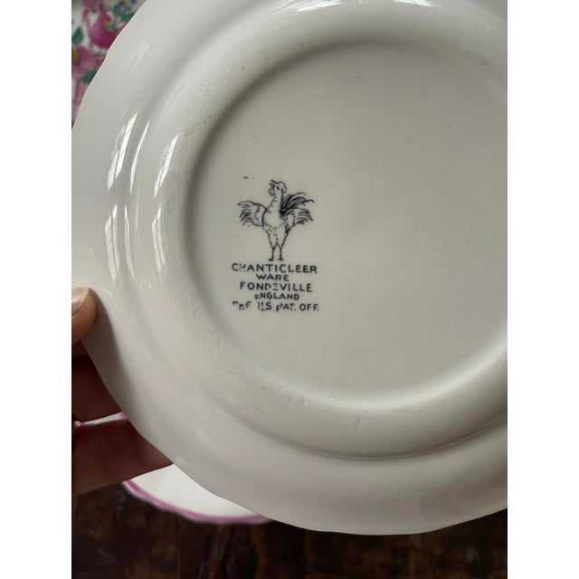 Wonderful set of 4 small dessert or bread plates, presented on a soft white, the Handpainted design is in a bubblegum pink...