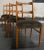 Set of four elegantly stylized Mid-Century Danish Modern dining chairs in beech hardwood. Reminiscent of Mid-Century...