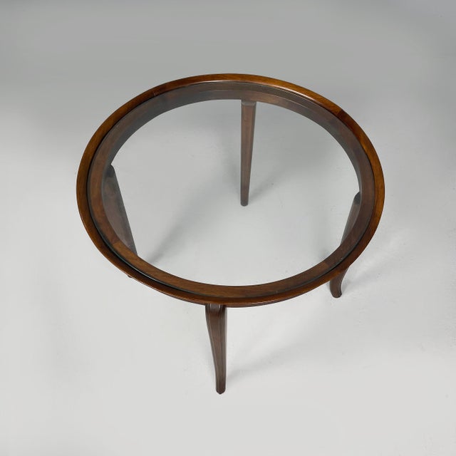 Italian Art Deco round coffe table in wood and glass, 1930s Coffee table with round glass top with wooden frame. The four...