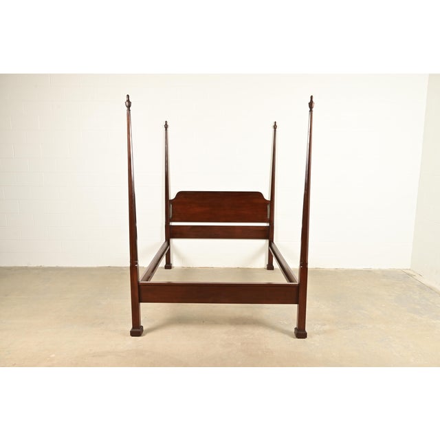 A gorgeous Georgian or Federal style four poster queen size bed By Harden USA, Circa Late 20th Century Carved solid cherry...