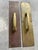 Primitive unlacquered brass cast brass door pulls attached to long, slim backplates. These have a patinated finish that...