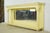 Vintage fireplace mantel with an integrated overmantel mirror. It features Corinthian style columns on either side and a...