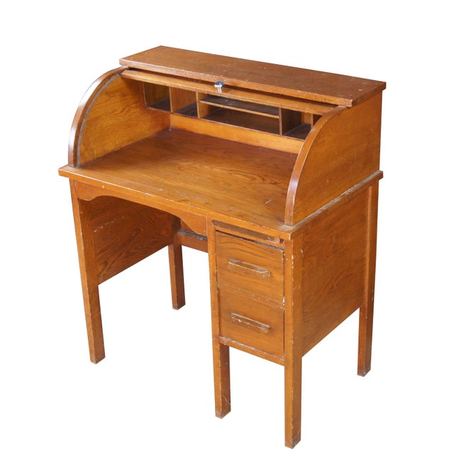 Victorian childs roll top writing desk featuring two drawers, a writing slide, a half cylinder roll top and interior...