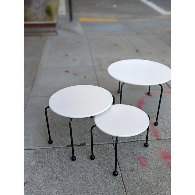 Channeling the bold spirit of the Memphis Group, this set of three Italian nesting tables is a masterclass in postmodern...