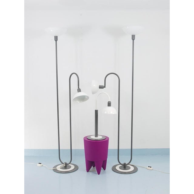 A pair of post-modern minimalist floor lamps, made in Italy in the 1980s and very much in the spirit of postmodern design....
