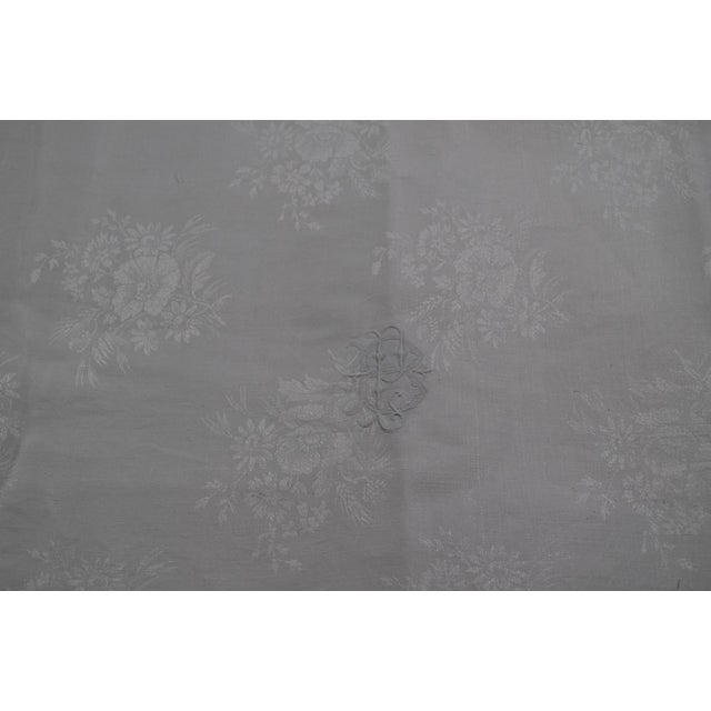 Large tablecloth In white damask cotton. Embroidered with the initials BP Approximately 78.7 inches x 118.1 inches In very...