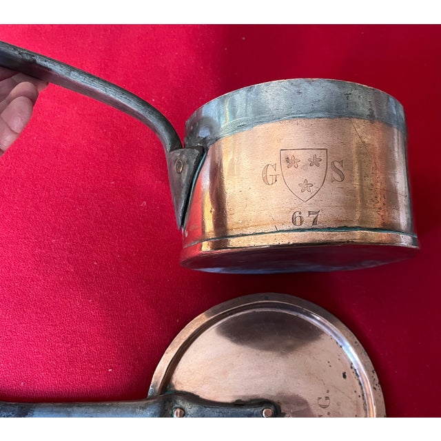 Antique 19th century English copper estate sauce pan with hand engraved crest on the side of the pan and monogram on the...