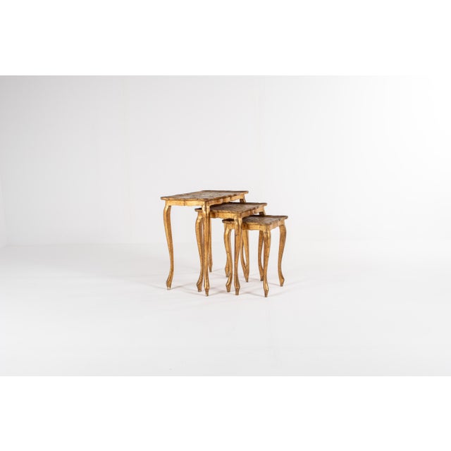 Beautiful set of 3 vintage Florentine wooden nesting tables, crafted in Italy and featuring classic gold gilt and hand-...