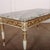 1920's French decorated marble topped coffee table. This piece is designed in the style of the selected designer and/or...