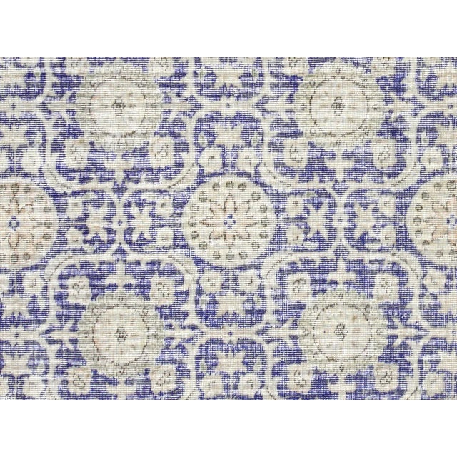 This Vintage Turkish Oushak Rug adds a vibrant touch to any home with its combination of wool and cotton. Measuring 5'3" x...