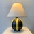 Decorative ceramic table lamp, circa 1950, France. Black and yellow striped enameled ceramic, new ivory fabric shade....