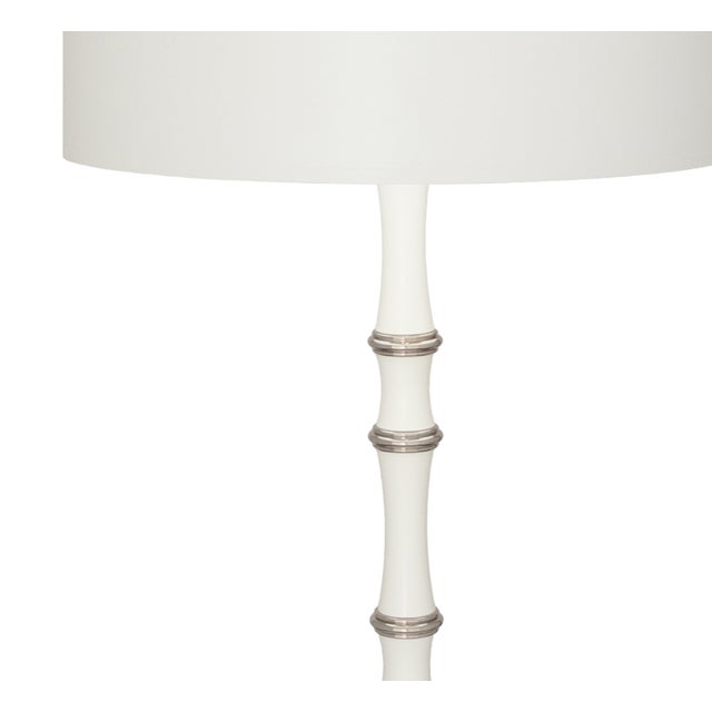 The Robert Abbey Kane Table Lamp adds a lovely touch to any room. With its matte daisy white and polished nickel finish,...