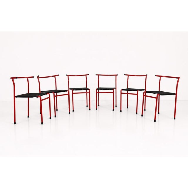 ‘Café’ chairs were designed in 1984 by Phillip Starck for Baleri Italia, it has a red painted steel frame and a seat made...