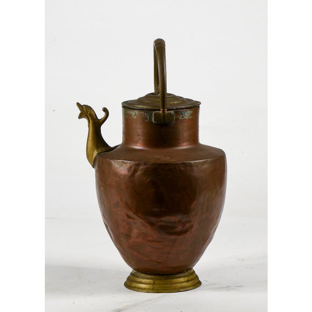 This imposing copper amphora-style pitcher is an authentic Italian antique dating back to the 1800s. The piece combines...