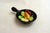 Small decorative wall-mounted pan/fondue with a trompe-l'oeil seaside design: black background & colorful "pinned"...